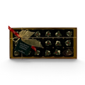 Chocolat in Kirkby Lonsdale gift box of 18 rum truffle Christmas puddings with white chocolate and holly decoration.