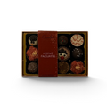Chocolat in Kirkby Lonsdale Festive Favourites gift box featuring 12 assorted Christmas-themed chocolates.