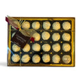Chocolat in Kirkby Lonsdale gift box of 24 white chocolate champagne truffles with a decorative gold ribbon