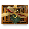 Chocolat in Kirkby Lonsdale luxury stack of 46 coffee-flavoured chocolates with a gold ribbon and gift tag.