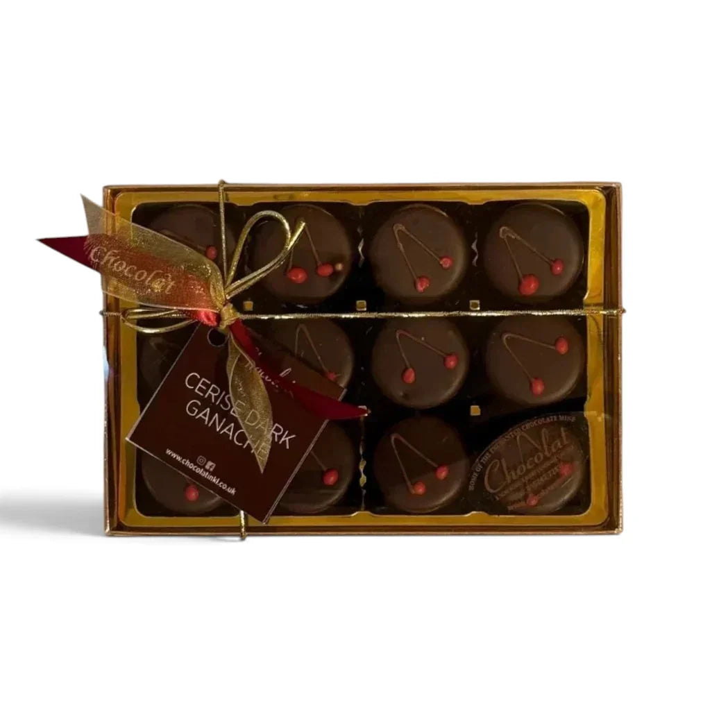 Chocolat in Kirkby Lonsdale gift box of 12 dark chocolate cerise ganache truffles with cherry detail and gold ribbon.