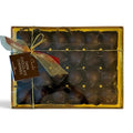 Chocolat in Kirkby Lonsdale gift box of 24 dark chocolate covered cherries soaked in Kirsch liqueur with gold ribbon