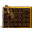 Chocolat in Kirkby Lonsdale gift box of 24 dark chocolate espresso ganache squares with a gold ribbon and tag.