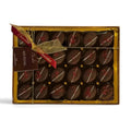 Chocolat in Kirkby Lonsdale gift box of 24 dark chocolate Kir Royal truffles with gold ribbon and red berry topping