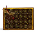 Chocolat in Kirkby Lonsdale gift box of 24 dark chocolate mint fondants with green swirl decoration and gold ribbon