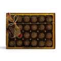 Chocolat in Kirkby Lonsdale gift box of 24 dark chocolate rum truffles with gold ribbon and festive tag