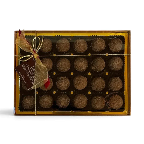 Chocolat in Kirkby Lonsdale gift box of 24 dark chocolate rum truffles with gold ribbon and festive tag