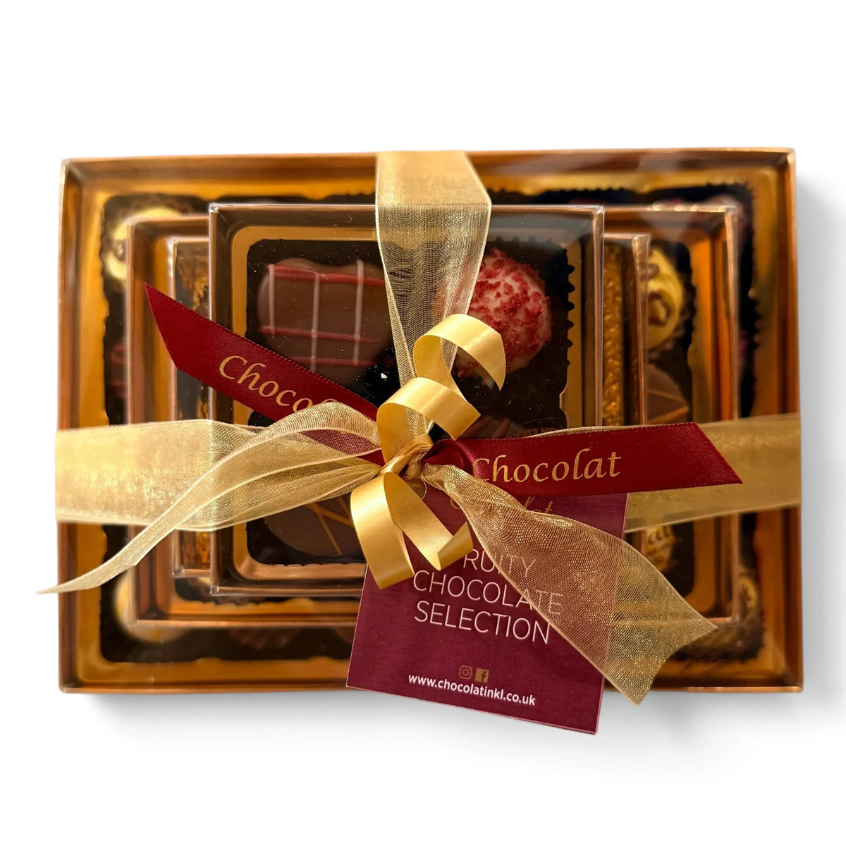 Chocolat in Kirkby Lonsdale luxury stack of 46 fruity chocolates wrapped in gold ribbon with a branded gift tag