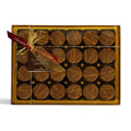 Chocolat in Kirkby Lonsdale gift box of 24 milk chocolate oranges with orange drizzle and decorative ribbon
