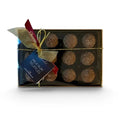Chocolat in Kirkby Lonsdale gift box of 12 milk chocolate rum truffles with a gold ribbon and branded tag