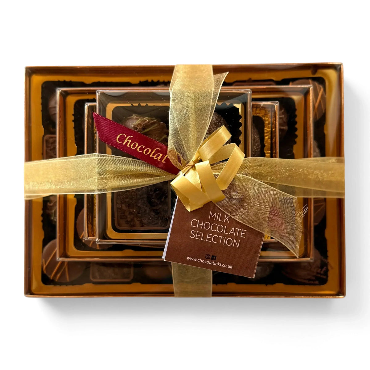 Chocolat in Kirkby Lonsdale luxury milk chocolate selection gift stack with gold ribbon and branded tag