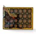 Chocolat in Kirkby Lonsdale gift box of 24 smooth milk chocolate truffles with a decorative gold ribbon