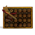 Chocolat in Kirkby Lonsdale gift box of 24 milk chocolate pistachio truffles with a decorative ribbon and tag.
