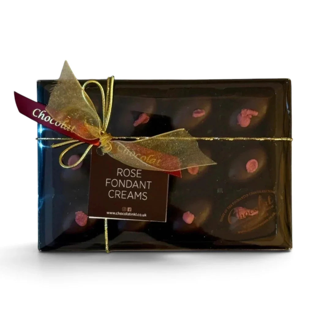 Chocolat in Kirkby Lonsdale gift box of 12 dark chocolate rose fondant creams with pink petal toppings and gold ribbon