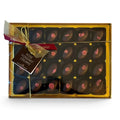 Chocolat in Kirkby Lonsdale gift box of 24 dark chocolate rose fondant creams with pink petal garnish and gold ribbon