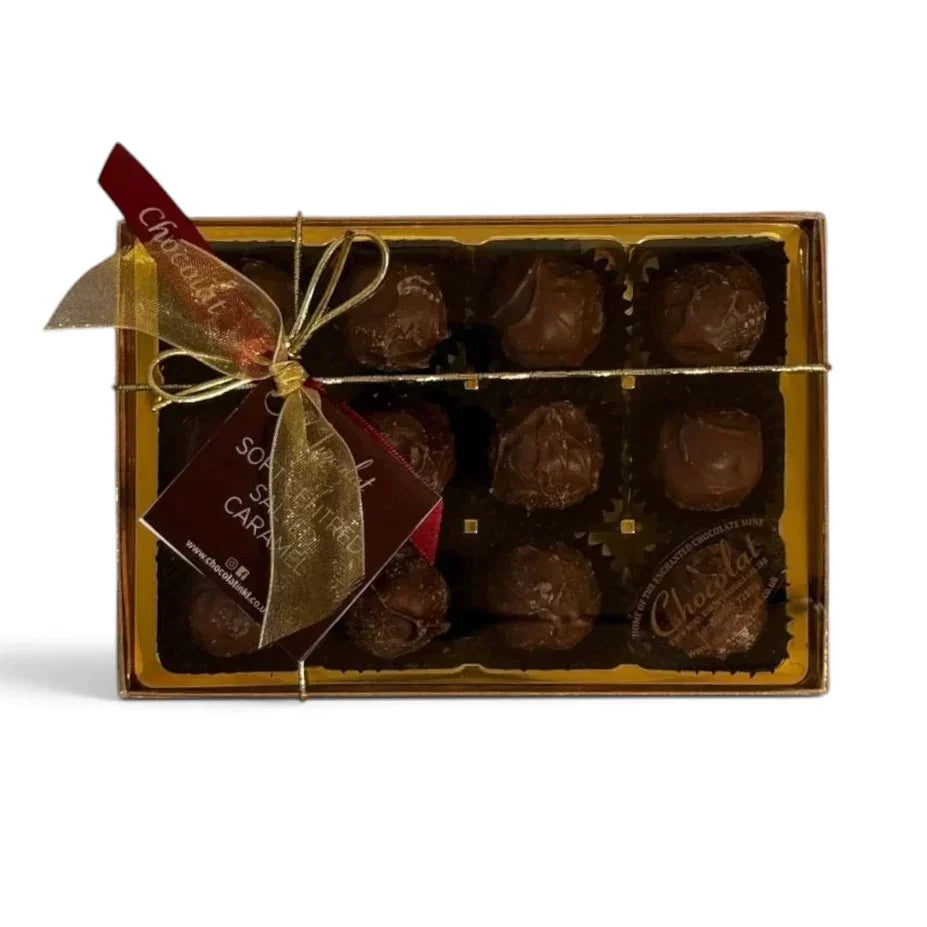 Chocolat in Kirkby Lonsdale gift box of 12 salted caramel milk chocolate truffles with a gold ribbon and tag.