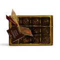 Chocolat in Kirkby Lonsdale gift box of 12 milk chocolate sticky toffee puddings with gold ribbon and branded tag.