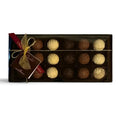 Chocolat in Kirkby Lonsdale gift box of 18 handcrafted milk, white, and dark chocolate truffles with gold ribbon.