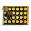 Chocolat in Kirkby Lonsdale gift box of 24 white chocolate vanilla truffles with gold ribbon and branded tag