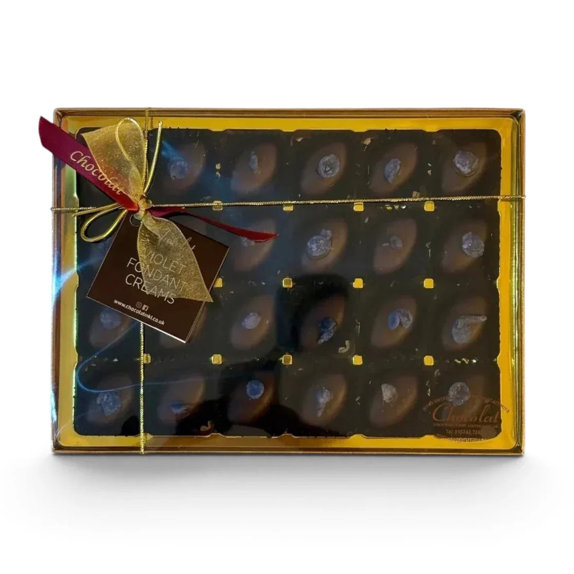 Chocolat in Kirkby Lonsdale gift box of 24 dark chocolate violet fondant creams with gold ribbon and floral topping