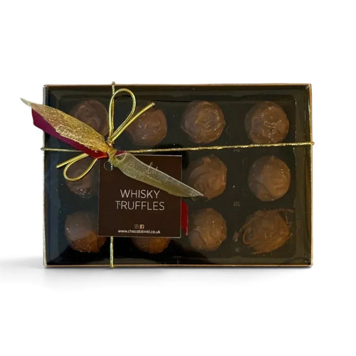 Chocolat in Kirkby Lonsdale gift box of 12 milk chocolate whisky truffles with a gold ribbon and branded label.