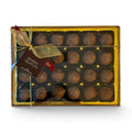 Chocolat in Kirkby Lonsdale gift box of 24 milk chocolate whisky truffles with a gold ribbon and branded gift tag.