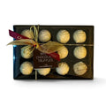 Chocolat in Kirkby Lonsdale gift box of 12 creamy white chocolate truffles with a decorative gold ribbon