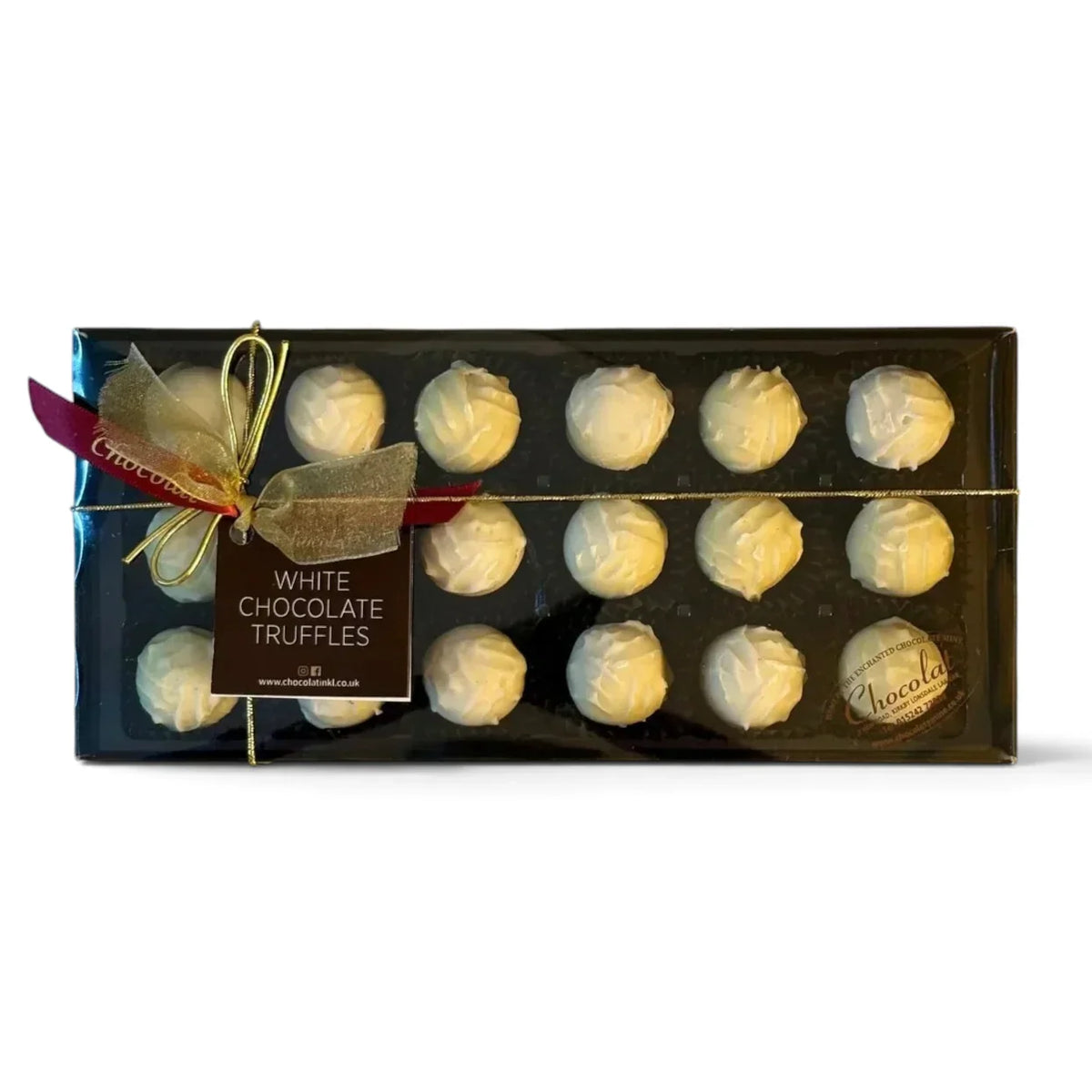 Chocolat in Kirkby Lonsdale gift box of 18 white chocolate truffles with a decorative gold ribbon and gift tag.
